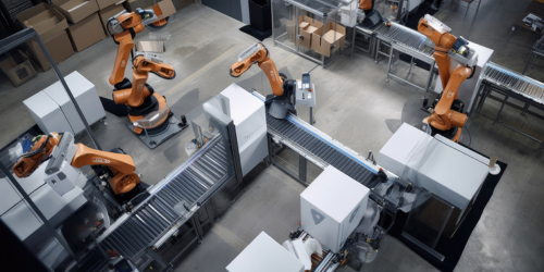 Industrial robots in warehouse.